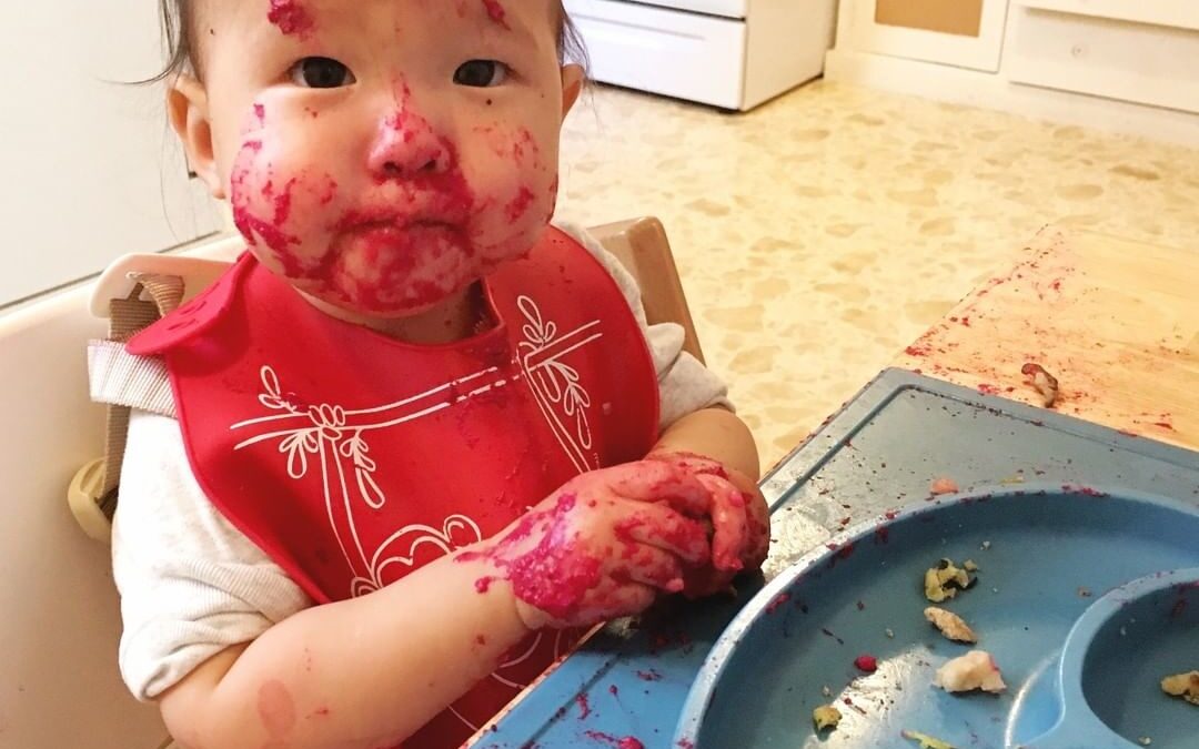 Learning to eat solid foods can be messy!